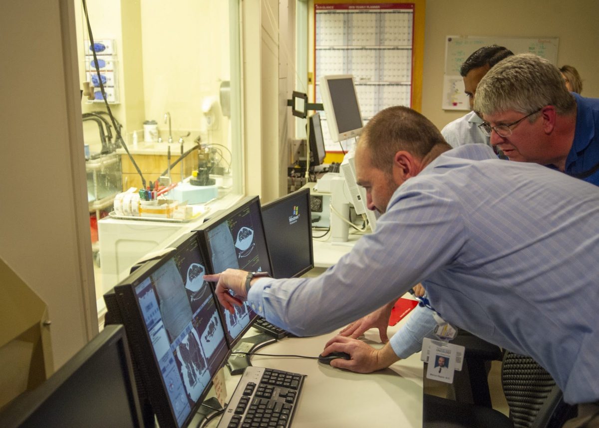 doctor reviewing CT machine screen