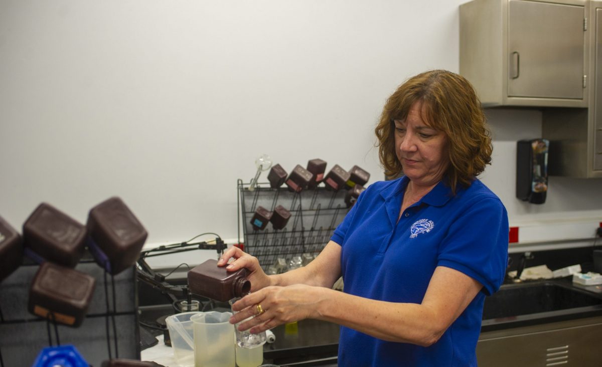 Senior Lab Technician Tina Stewart prepares water samples for testing