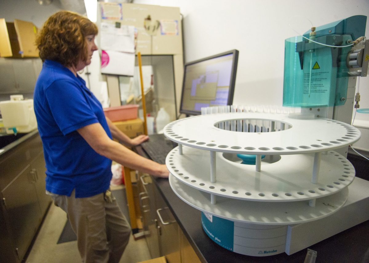 Senior Lab Technician Tina Stewart analyzes water samples in the Water Test Lab