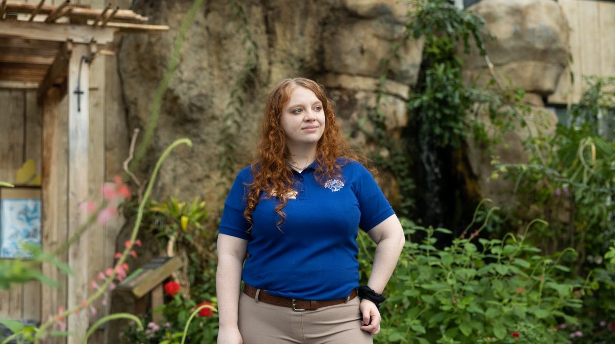 Rose Segbers standing in butterfly garden