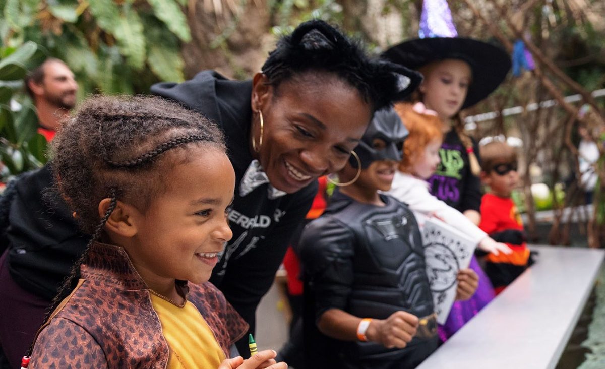 costumed family at touch tank