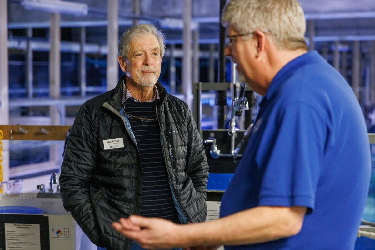 Tennessee Aquarium Vice President and Chief Operating Officer Jackson Andrews listens while Veterinarian Dr. Chris Keller discusses preparations for an animal care procedure