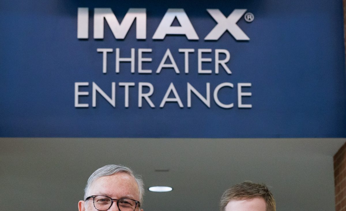 Tennessee Aquarium VP and Chief Operating Officer Gordon Stalans, left, presents a check for $1500 to Brett Baker and the South East Tennessee Area Young Marines. The funds, raised from Veterans Day weekend screenings of D-Day: Normandy 1944 3D at the Tennessee Aquarium IMAX 3D Theater, will help the Young Marines travel to Normandy in 2024 for the 80th anniversary of D-Day.