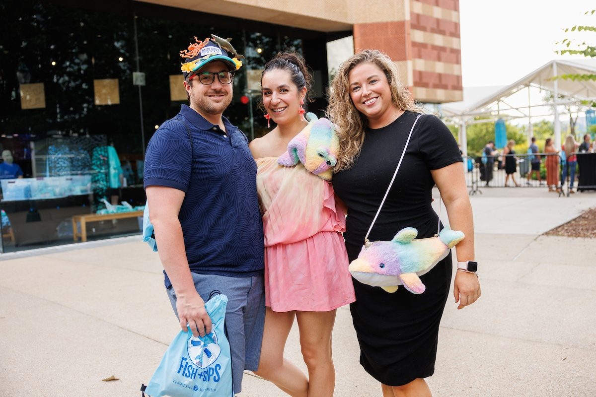 guests in front of Aquarium during Fish + Sips event