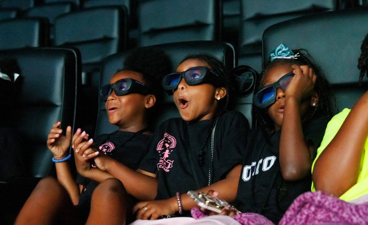 Audiences react to a screening of a giant-screen film at the Tennessee Aquarium IMAX 3D Theater. In 2016, the Aquarium invested in the installation of a state-of-the-art IMAX with Laser audiovisual suite, technology which is available in only a handful of theaters in North America.