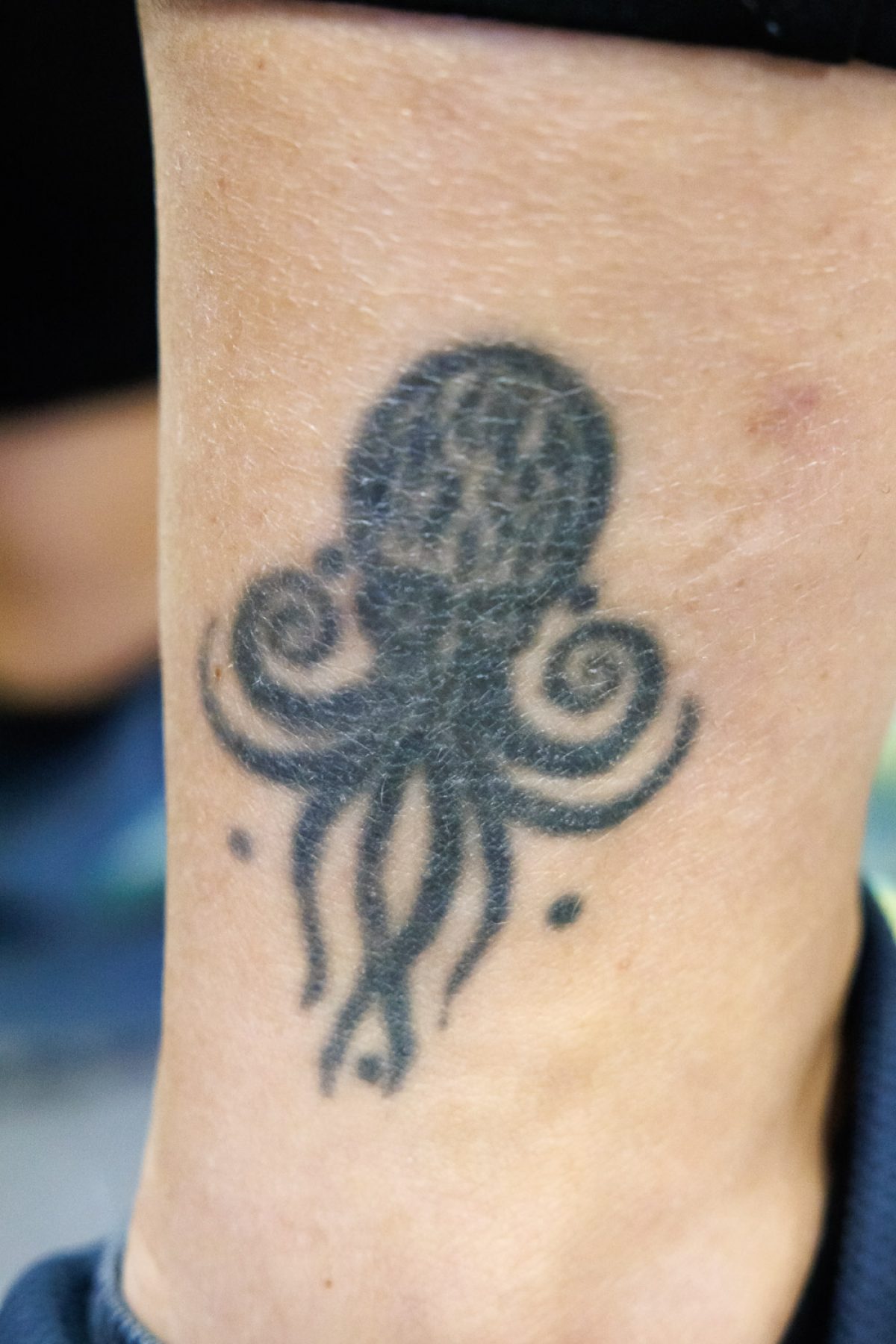 Black and white tattoo of an octopus