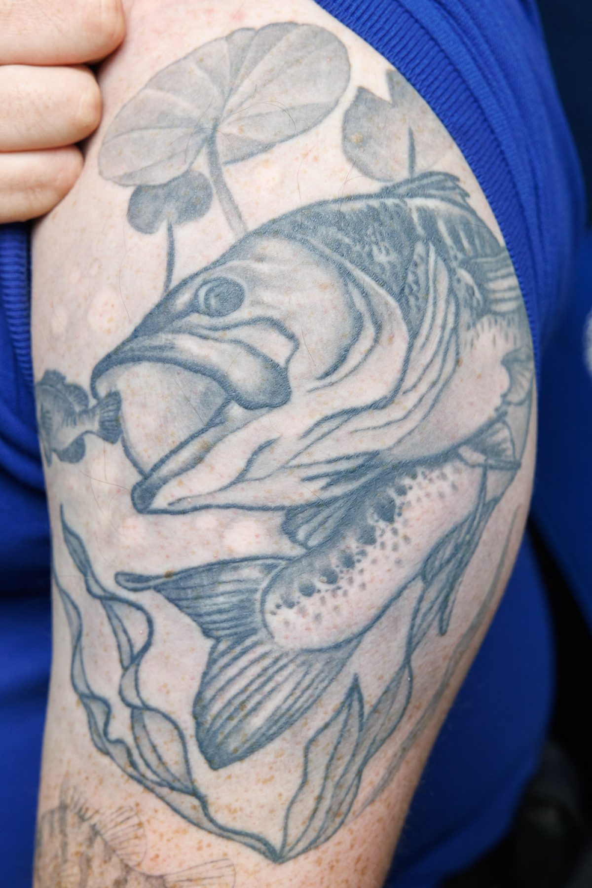 Black and white tattoo of a bass