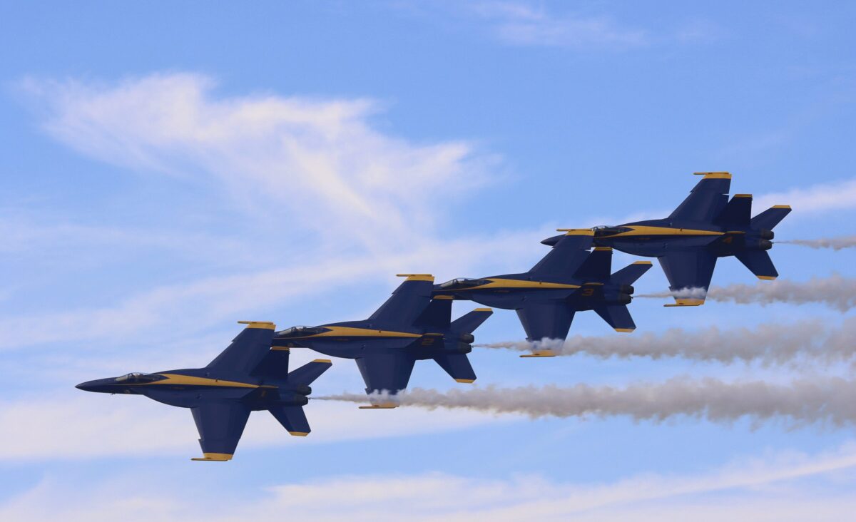 The Blue Angels pilots perform the Diamond Echelon Parade.